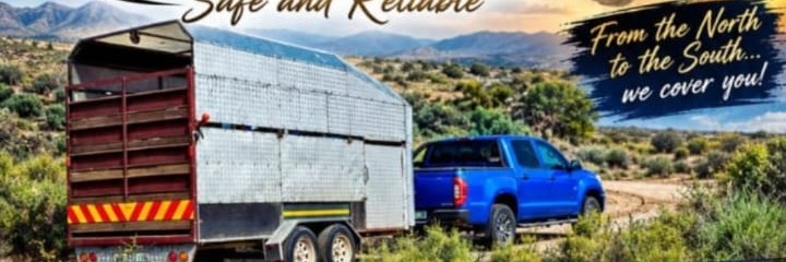 Lieben Fourie's livestock trailer and blue bakkie on a dirt road in the veld